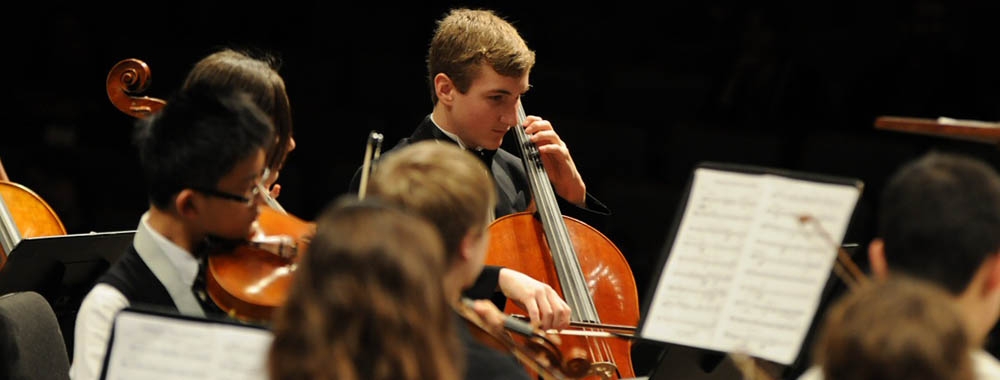 Cello player performing on stage