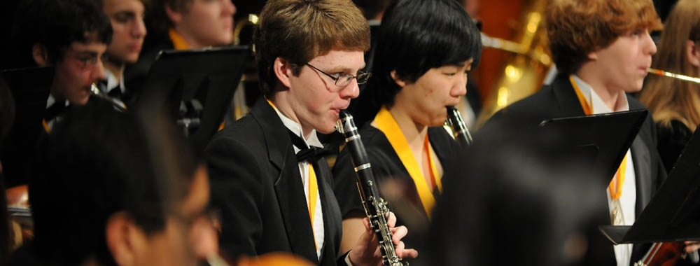 Student clarinetists and bassoonists in concert on stage